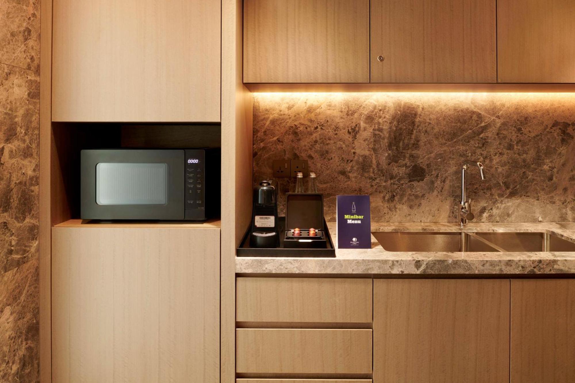 Отель Doubletree By Hilton Shah Alam I-City Экстерьер фото A microwave oven in a kitchen